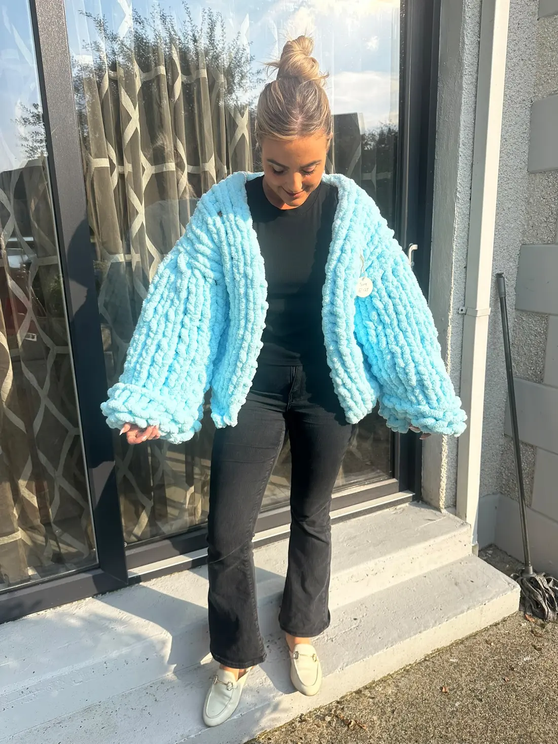 Sky blue Ladies Shacket worn open over a black top and jeans